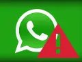 WhatsApp-Logo mit rotem Ausrufezeichen auf grünem Hintergrund.